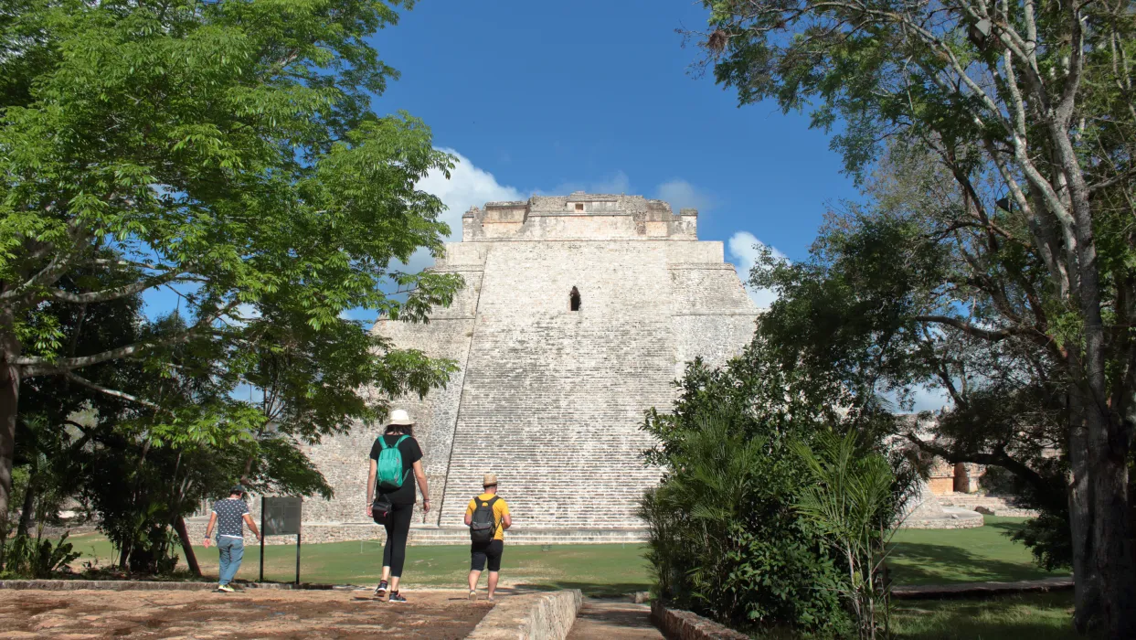 People walking to a pyramid